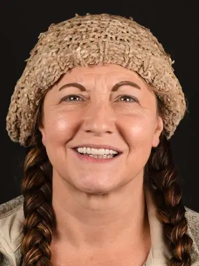 Patient smiling with new upper All-on-X implant teeth