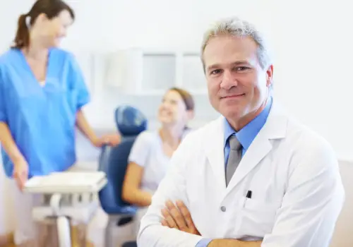 Front desk team member helping a patient