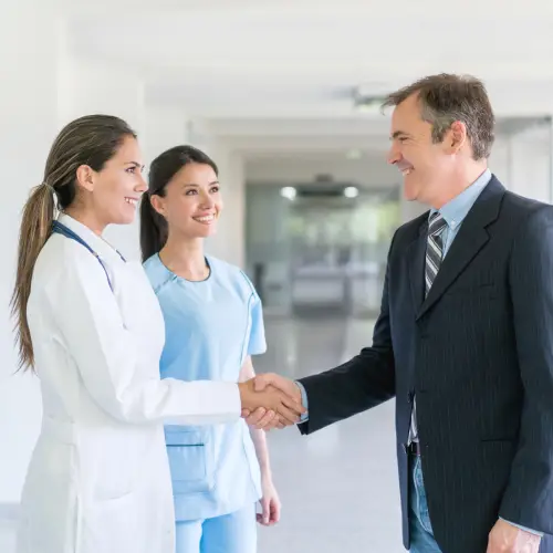 Patient being welcomed at the front desk for a first visit