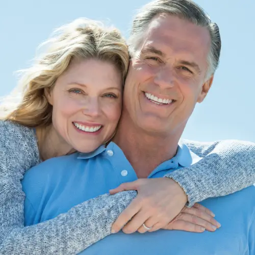 Smiling mature couple embracing outdoors