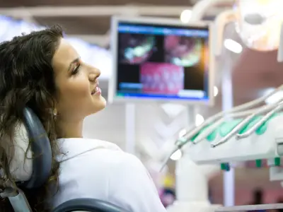 Dentist working with a dental microscope