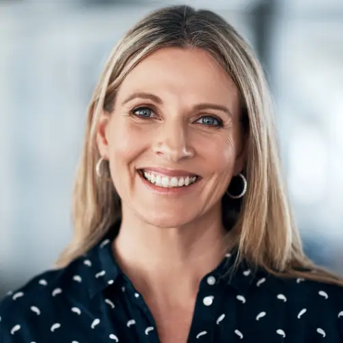Smiling woman with shoulder-length blonde hair